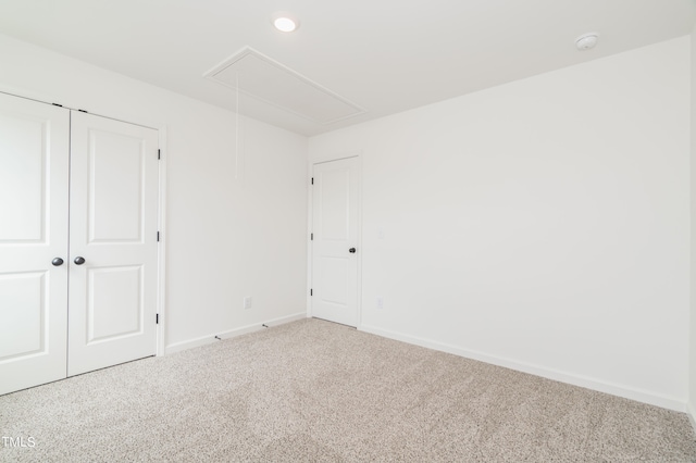 unfurnished room featuring carpet