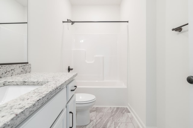 full bathroom featuring washtub / shower combination, vanity, and toilet