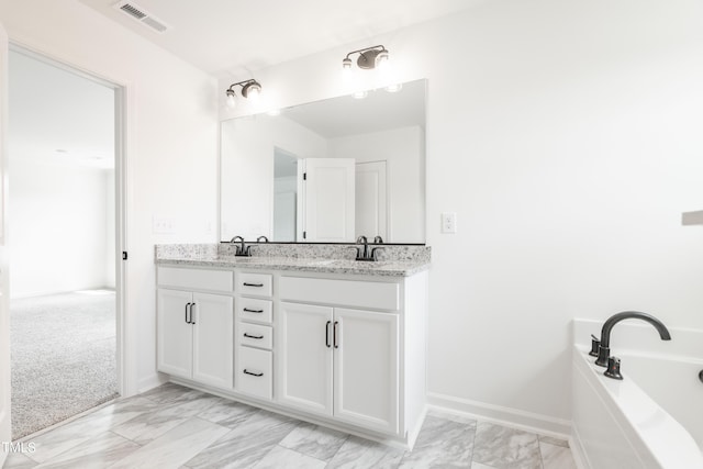 bathroom featuring a bathtub and vanity