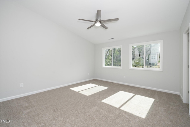 empty room with carpet floors, ceiling fan, and lofted ceiling