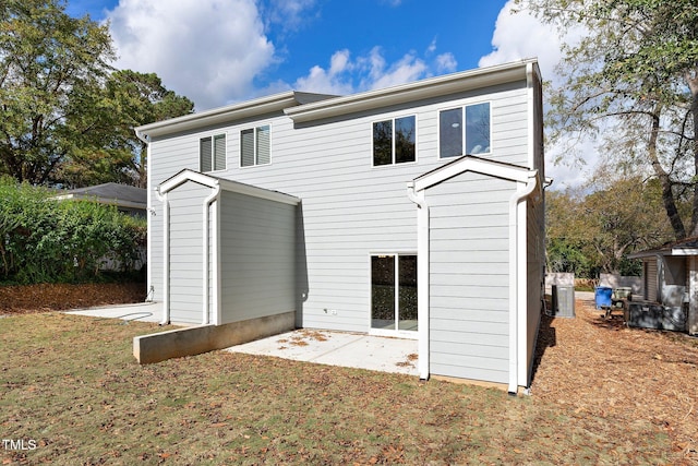 back of property with a patio area