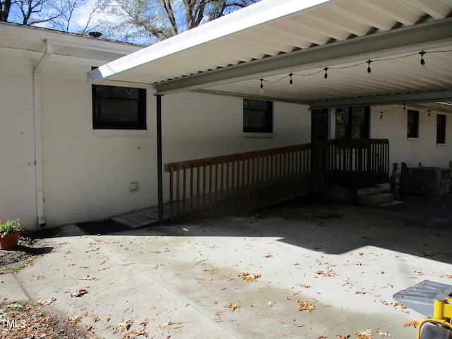 exterior space featuring a carport