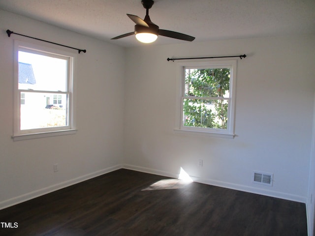 unfurnished room featuring ceiling fan and dark hardwood / wood-style floors