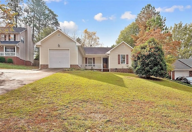 view of front of house with a garage, a porch, and a front yard