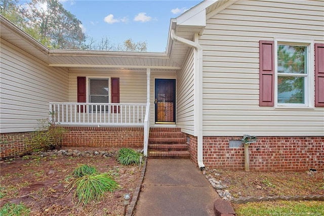 entrance to property with a porch