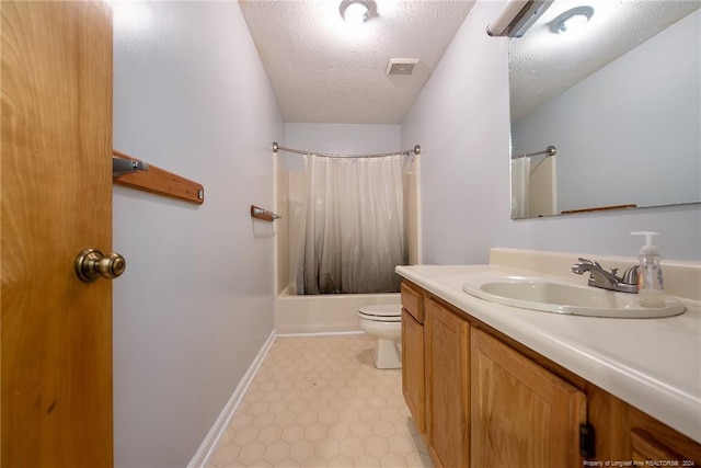 full bathroom featuring toilet, vanity, a textured ceiling, and shower / bath combo with shower curtain