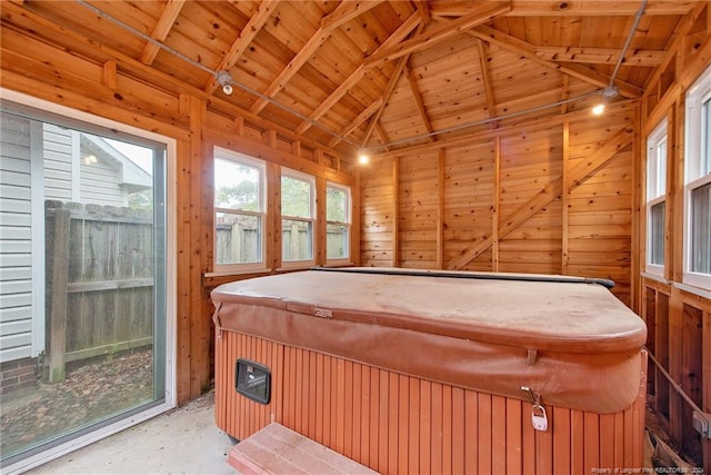 interior space featuring wood ceiling, a jacuzzi, and lofted ceiling