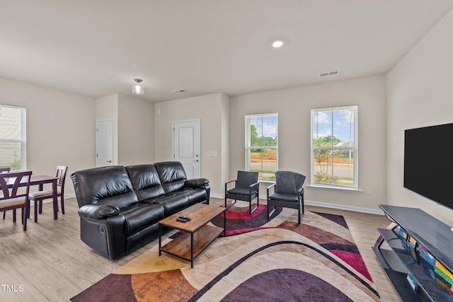 living room with light hardwood / wood-style floors