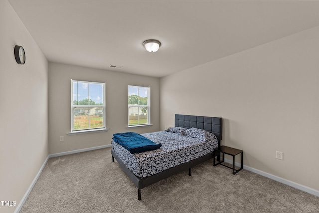 bedroom with light carpet