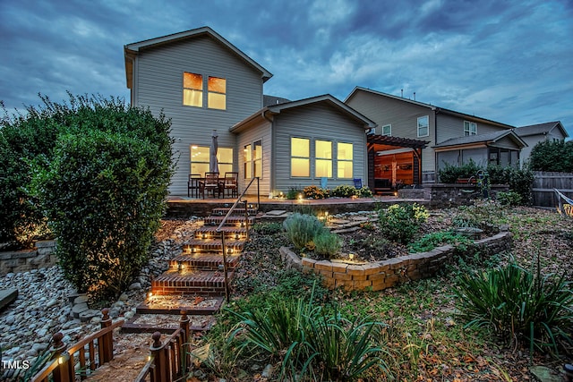 back of house with a patio and a pergola