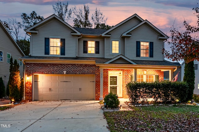 view of front of property with a garage