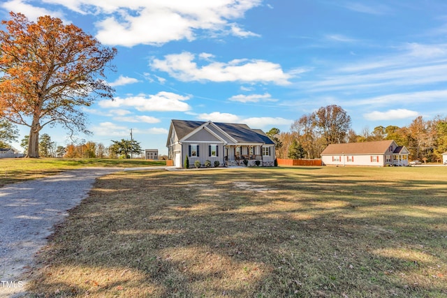 view of front of home with a porch and a front lawn