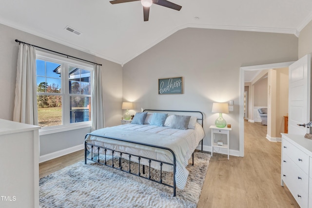 bedroom with ceiling fan, light hardwood / wood-style floors, vaulted ceiling, and crown molding