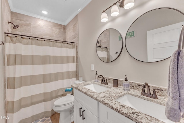 bathroom featuring ornamental molding, curtained shower, vanity, and toilet