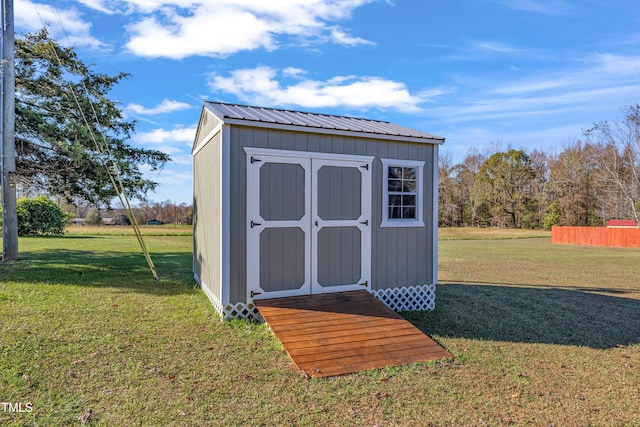 view of outdoor structure with a lawn