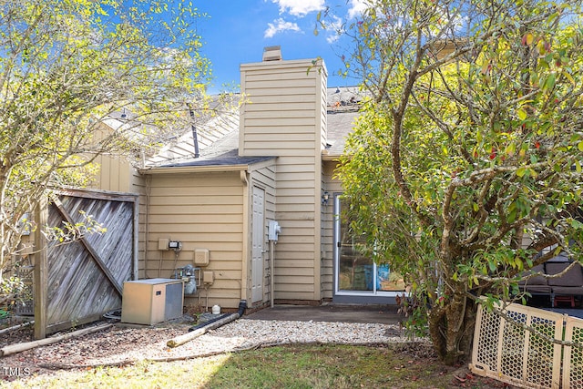 back of house with cooling unit