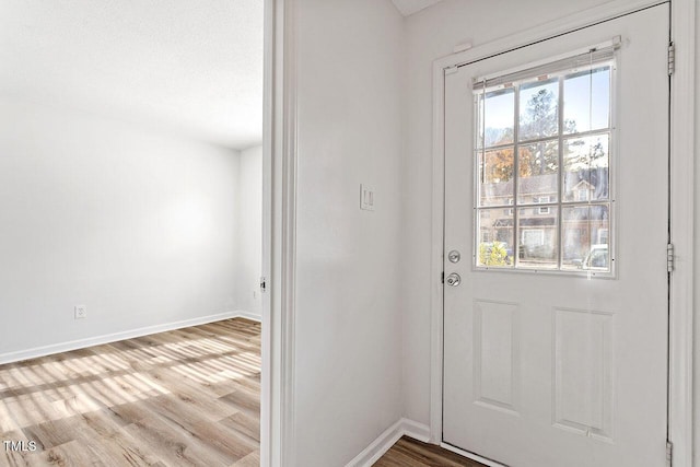 14 Stone Village Ct, Durham, NC 27704 - doorway with baseboards and wood finished floors