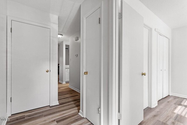 14 Stone Village Ct, Durham, NC 27704 - hallway with wood finished floors and baseboards