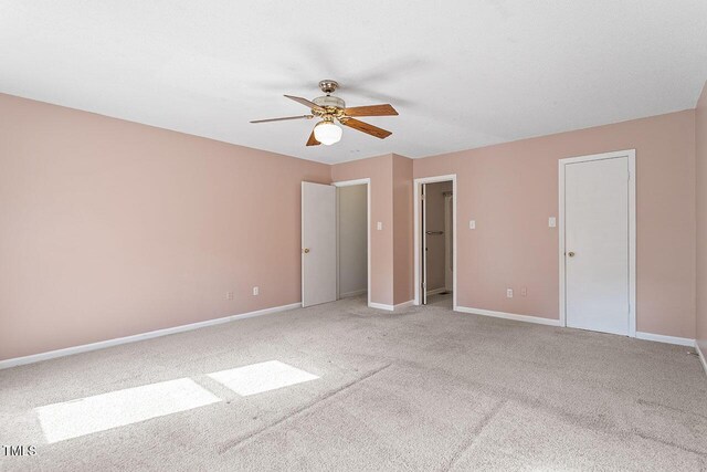 14 Stone Village Ct, Durham, NC 27704 - unfurnished bedroom featuring light colored carpet, baseboards, and a ceiling fan