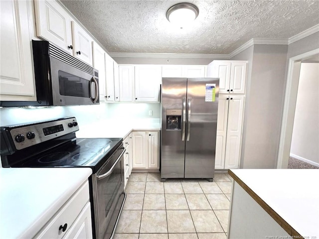 kitchen featuring light tile patterned floors, white cabinetry, appliances with stainless steel finishes, and crown molding