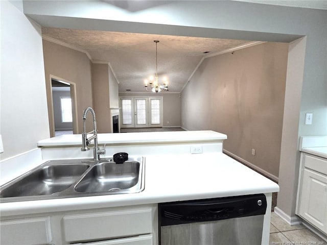 kitchen featuring dishwasher, white cabinetry, sink, ornamental molding, and lofted ceiling