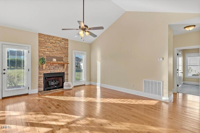 unfurnished living room with plenty of natural light, ceiling fan, and light hardwood / wood-style flooring