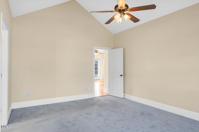 spare room featuring carpet flooring, ceiling fan, and high vaulted ceiling