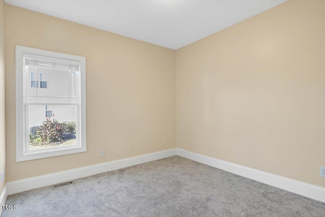 unfurnished room with light colored carpet