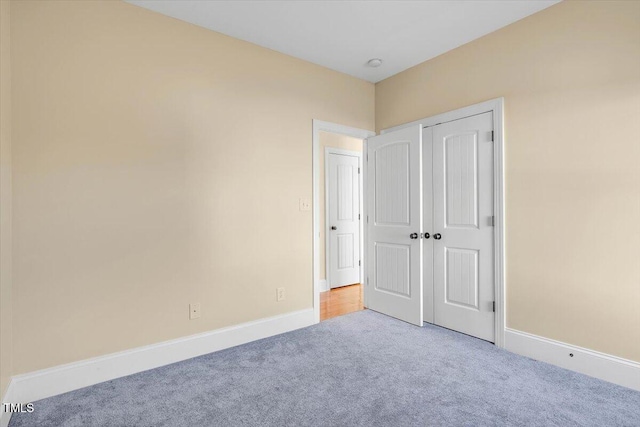 unfurnished bedroom with light carpet