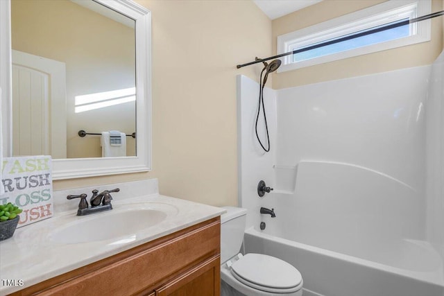 full bathroom with vanity, toilet, and shower / tub combination