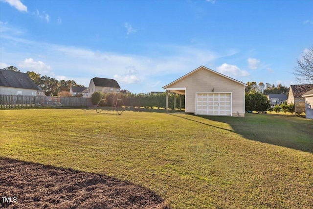 view of yard with an outdoor structure and a garage