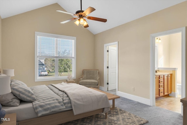 bedroom with connected bathroom, ceiling fan, and lofted ceiling