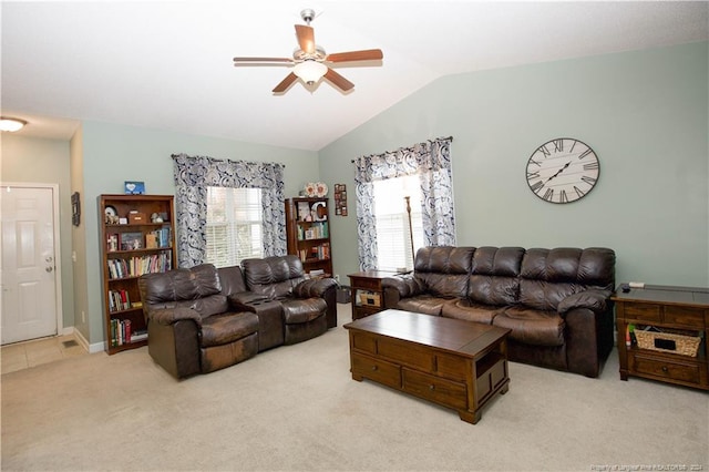 living room with ceiling fan, light carpet, and vaulted ceiling