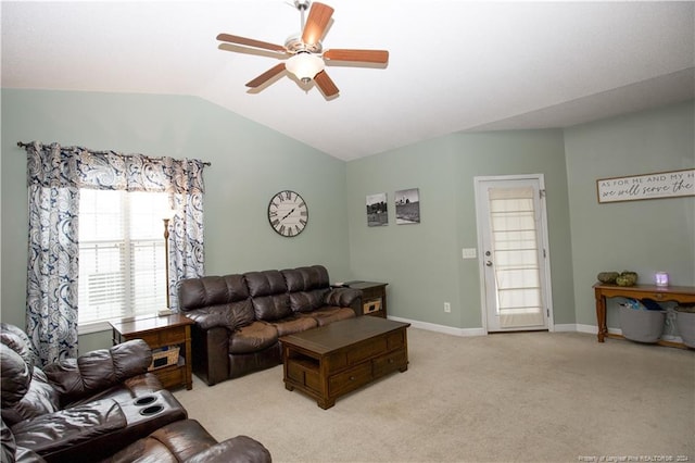 carpeted living room with vaulted ceiling and ceiling fan