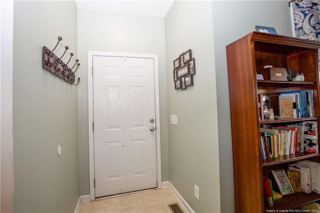 entryway featuring light tile patterned flooring