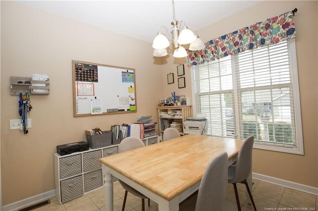 tiled dining space with a notable chandelier