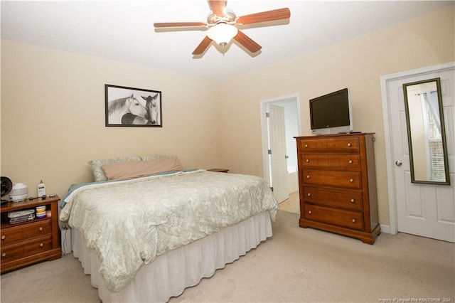 bedroom with light carpet and ceiling fan