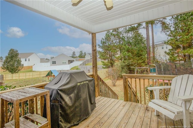 wooden terrace featuring a grill