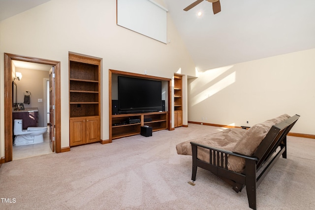 living room with carpet floors, high vaulted ceiling, and ceiling fan