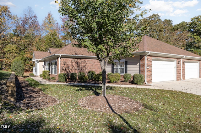 view of front facade with a front lawn and a garage