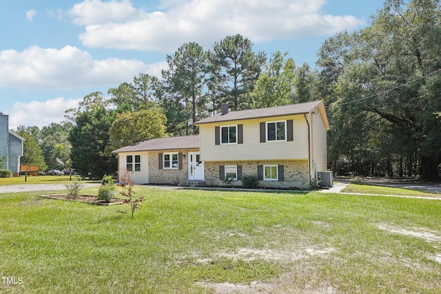 tri-level home with a front lawn