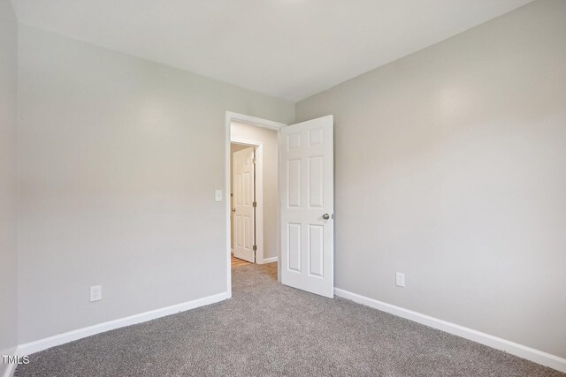 unfurnished room with carpet floors