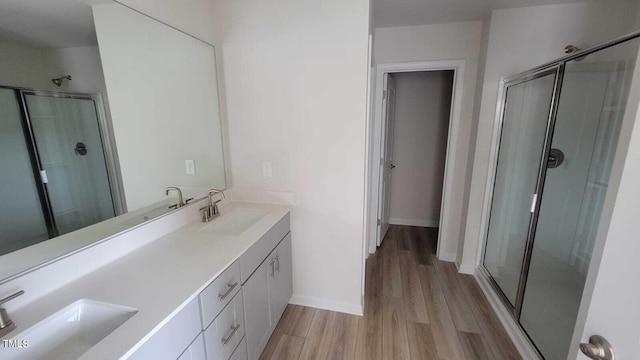 1071 Cherry Stem Rd, Haw River, NC 27258 - full bathroom with wood finished floors, double vanity, and a stall shower