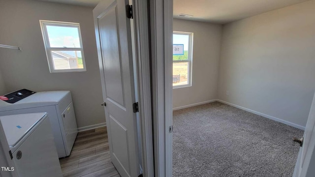 1071 Cherry Stem Rd, Haw River, NC 27258 - washroom with washing machine and dryer, plenty of natural light, and light carpet