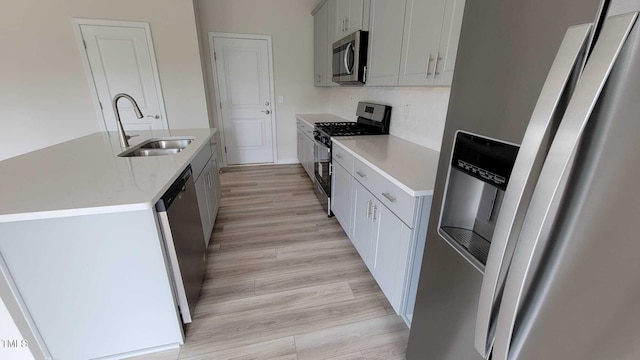 1071 Cherry Stem Rd, Haw River, NC 27258 - kitchen featuring stainless steel appliances, a kitchen island with sink, and light wood-type flooring