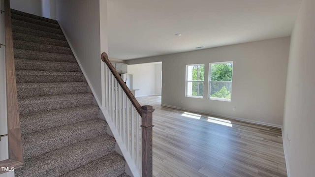 1071 Cherry Stem Rd, Haw River, NC 27258 - stairs featuring wood finished floors and baseboards