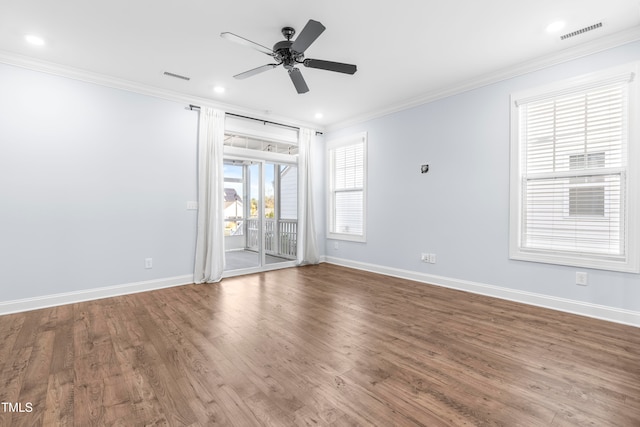 spare room with ceiling fan, wood-type flooring, and ornamental molding