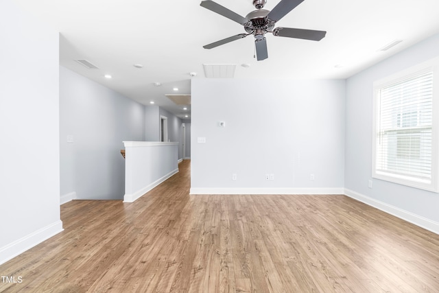 unfurnished room with ceiling fan and light hardwood / wood-style floors