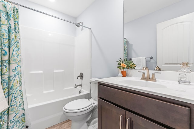 full bathroom with tile patterned floors, vanity, shower / tub combo, and toilet