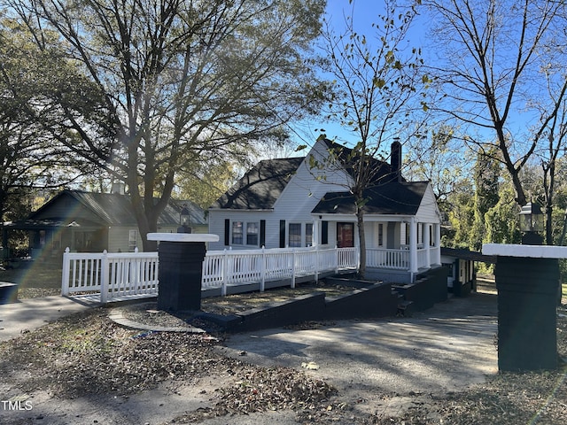 view of front of property with a wooden deck